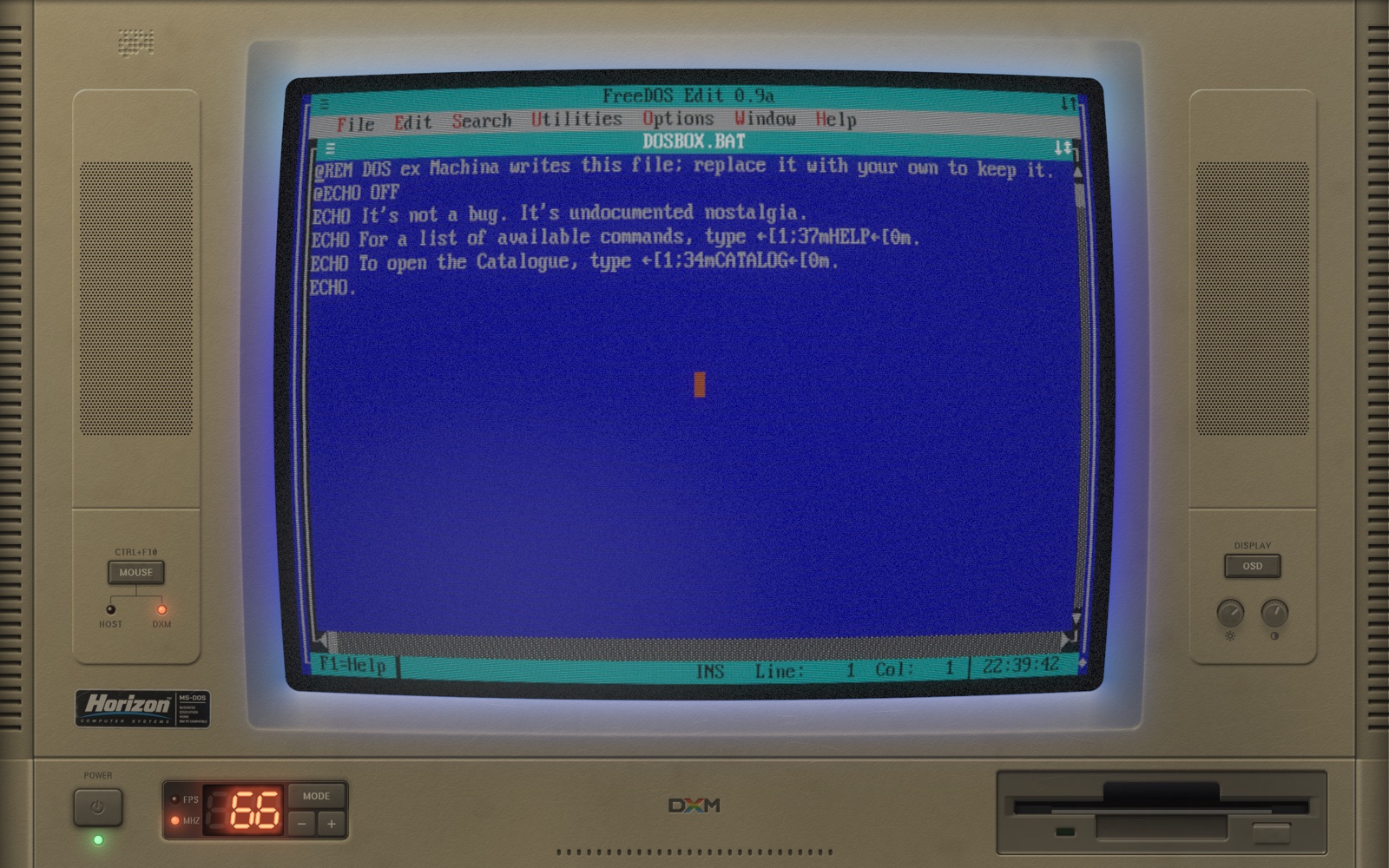 FreeDOS EDIT in blue text mode, the tube's blue light spilling onto the bezel